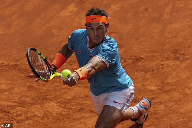 13255436-7007091-Nadal_lost_four_points_on_his_serve_in_the_first_set_as_he_reach-a-12_1557335205405.jpg